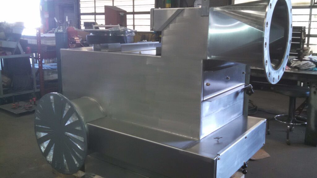 Samsung DeDuster® stainless steel system during fabrication at GSM Industrial Lancaster PA, showing in-progress forming and welding before final polishing to showroom-quality finish