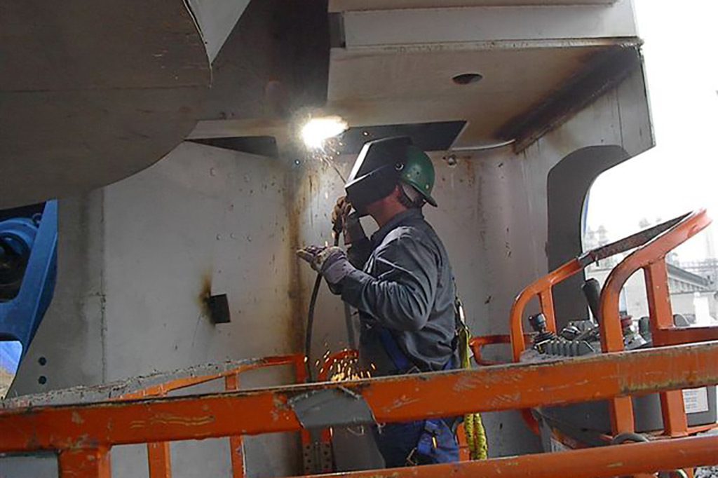 Worker welding on job site