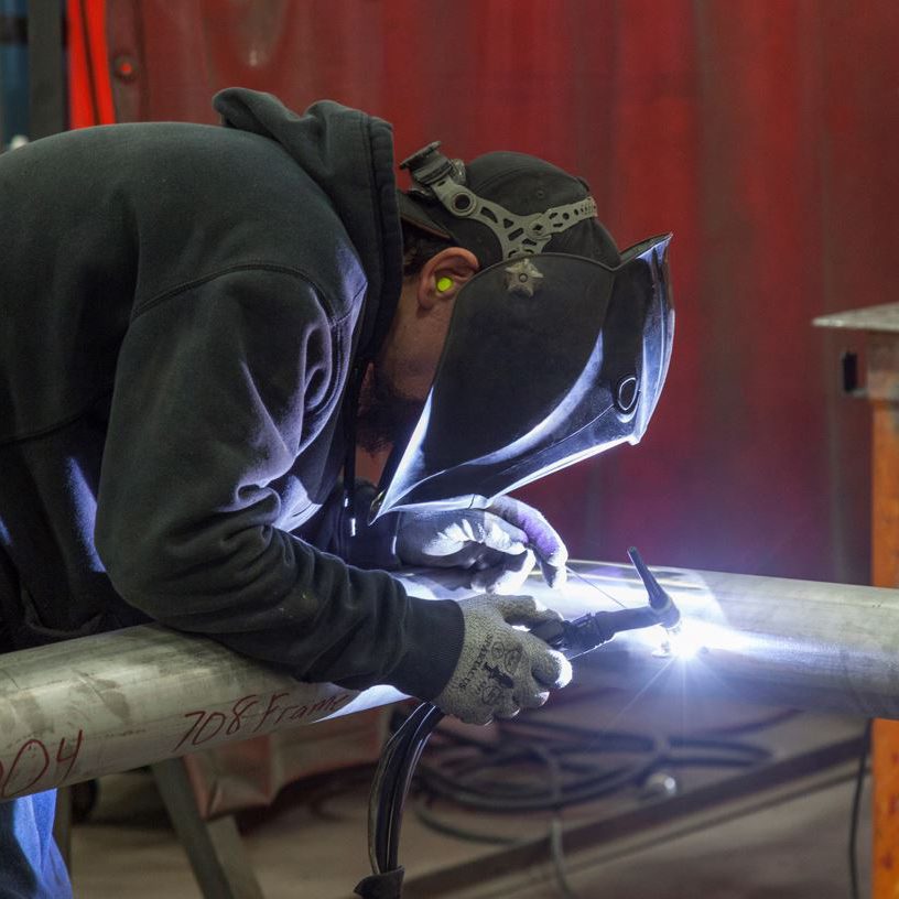 welder working on piping