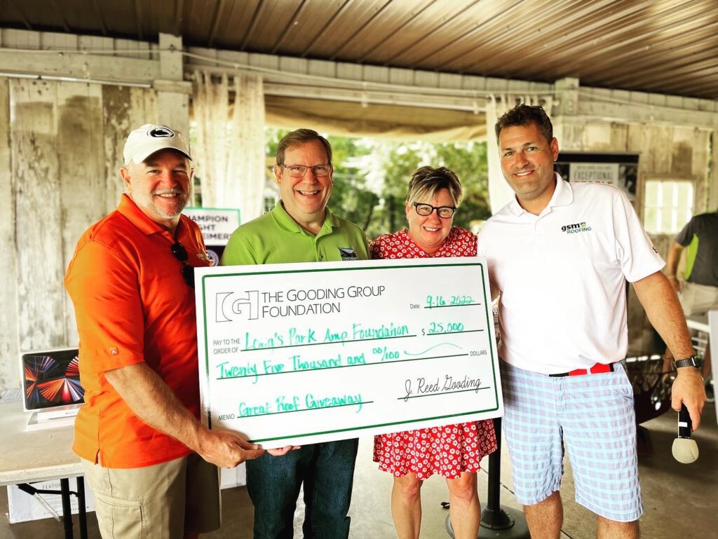 Brian Dombach and Reed Gooding presenting a check to the Long's Park Amphitheatre