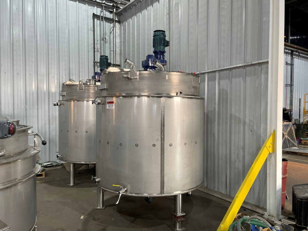 Completed stainless steel lime slaker and slurry tank system fabricated by GSM Industrial, delivered to municipal water treatment facility in Brookings, South Dakota