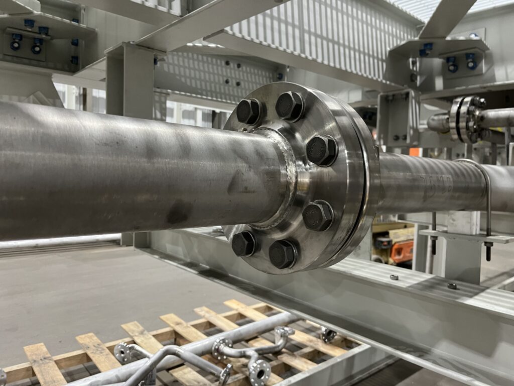 Heavy-duty flanged stainless steel pipe section, fabricated and tested by GSM Industrial for a wastewater treatment application.