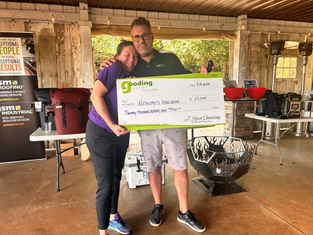 Reed Gooding presenting the check of 20,000 dollars to the Alzheimer's association
