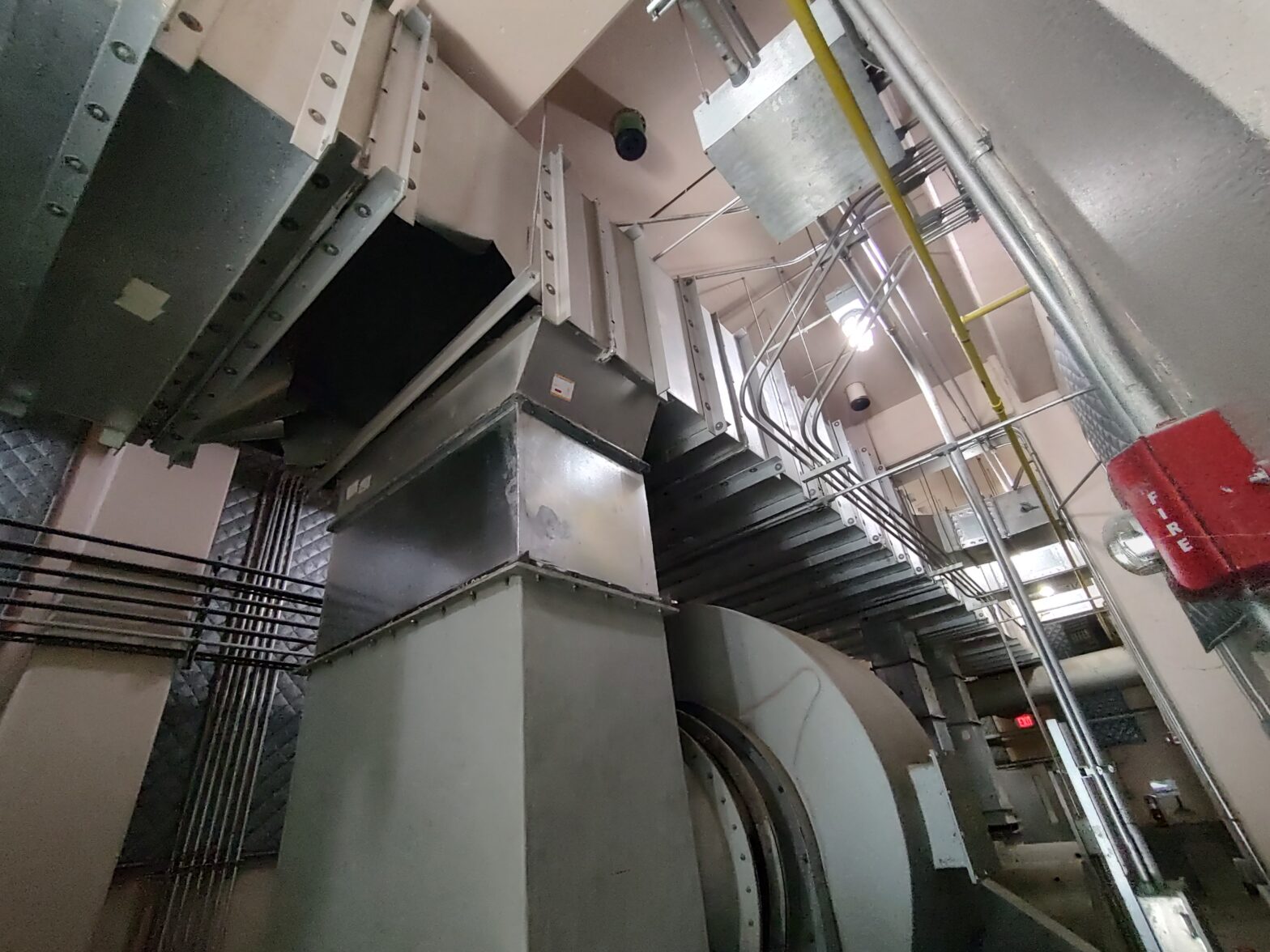 New duct sections installed above existing industrial machinery during GSM Industrial’s emergency duct replacement project.