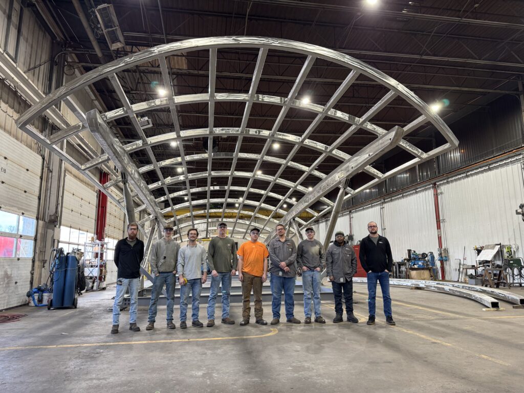 GSM Industrial fabrication team standing in front of the nearly completed architectural canopy before delivery to Washington D.C.