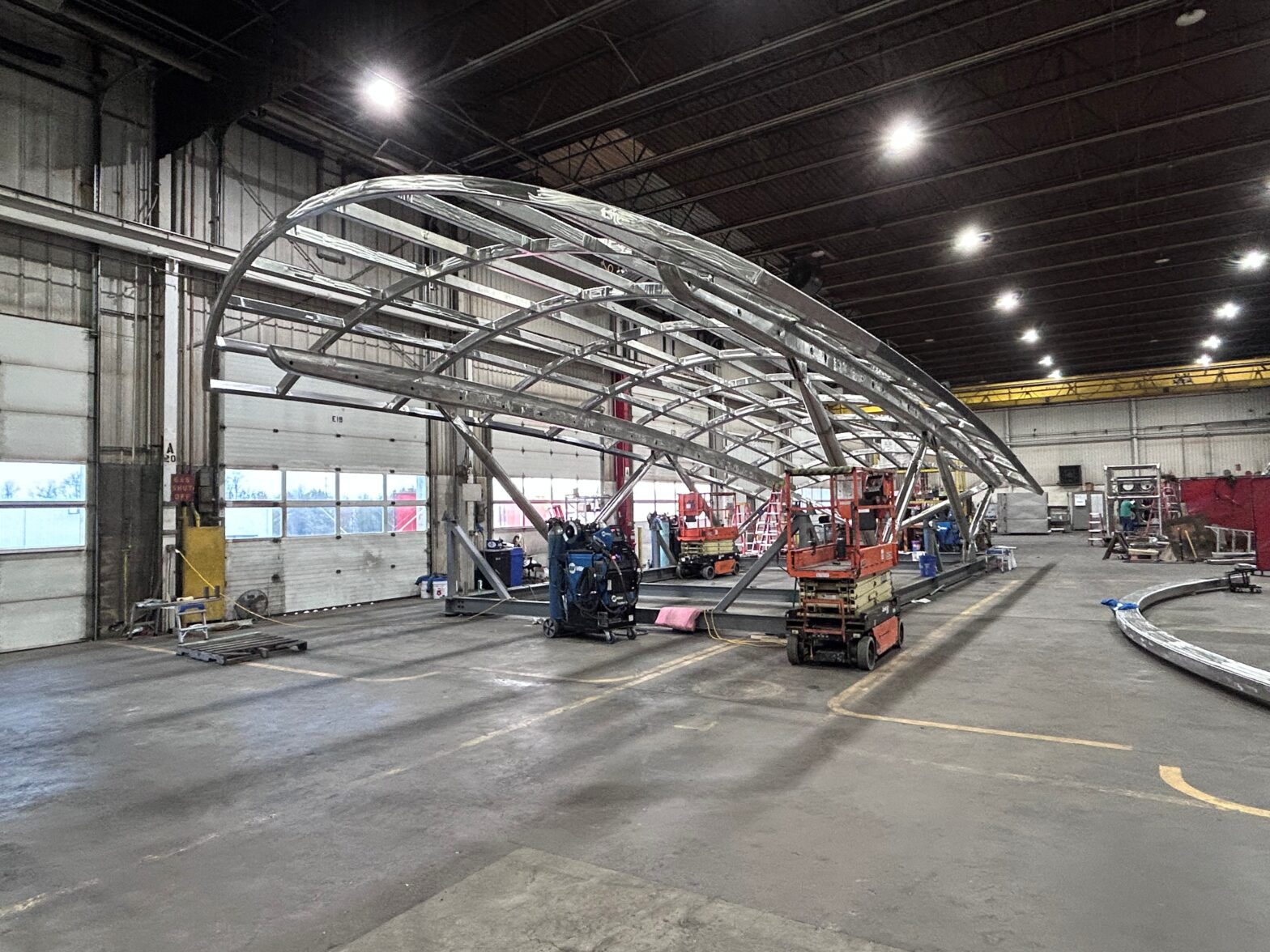 Architectural stainless-steel canopy structure under fabrication in GSM Industrial’s shop, showing full frame assembly for the Washington D.C. U-Street Station.